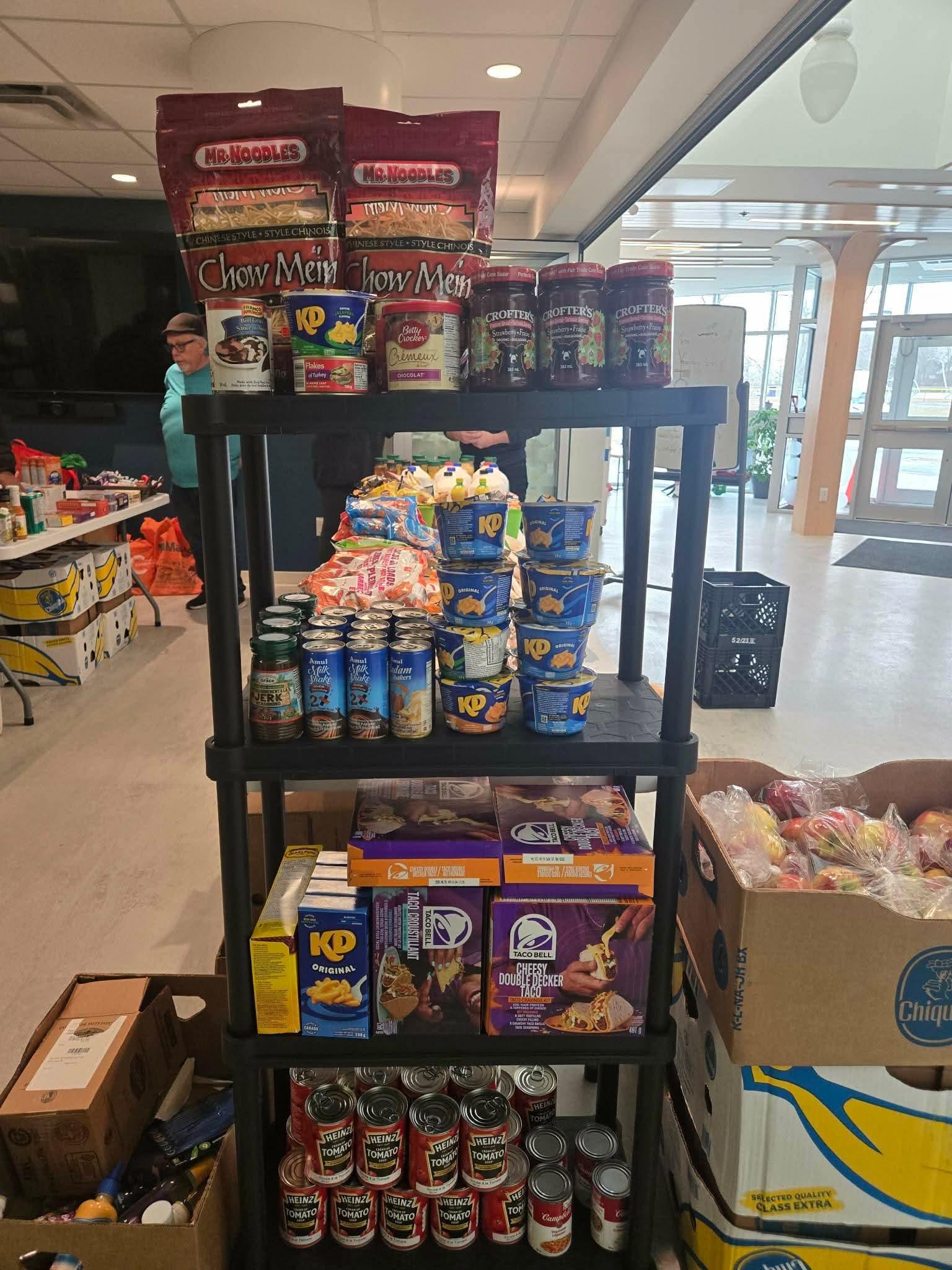 Large free market shelving unit stocked with food